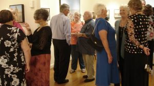 People in conversation at an Opening Night in the Wondai Art Gallery